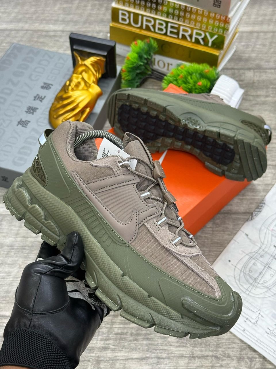 Sneakers in a vibrant olive green color, featuring a unique design and a comfortable fit. The brand is known for its high-quality products and excellent customer service.