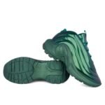Sneakers in a vibrant teal color, designed with a sleek, modern aesthetic. Featuring a unique curved design and high-quality materials.