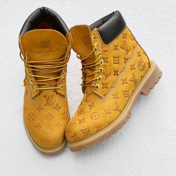 Sneakers, loafers, and boots in a gold color with a monogram pattern, perfect for Nigerian shoppers looking for trendy footwear.