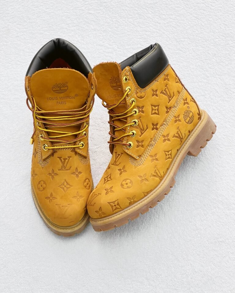 Sneakers, loafers, and boots in a gold color with a monogram pattern, perfect for Nigerian shoppers looking for trendy footwear.