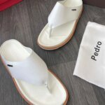 Sneakers, loafers, and sandals in white and orange, designed for everyday wear and a touch of style.