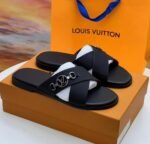 Sneakers, loafers, and slip-ons in black leather, featuring a distinctive cross-stitch pattern and a silver buckle closure. Designed for both men and women, these sandals are perfect for everyday wear or special occasions.