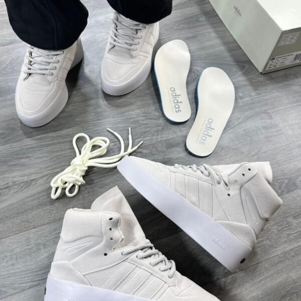 Sneakers with a unique, high-top design and platform sole, ideal for everyday wear or special occasions. Available in various colors and styles.