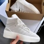 Sneakers with a unique, high-top design and platform sole, ideal for everyday wear or special occasions. Available in various colors and styles.