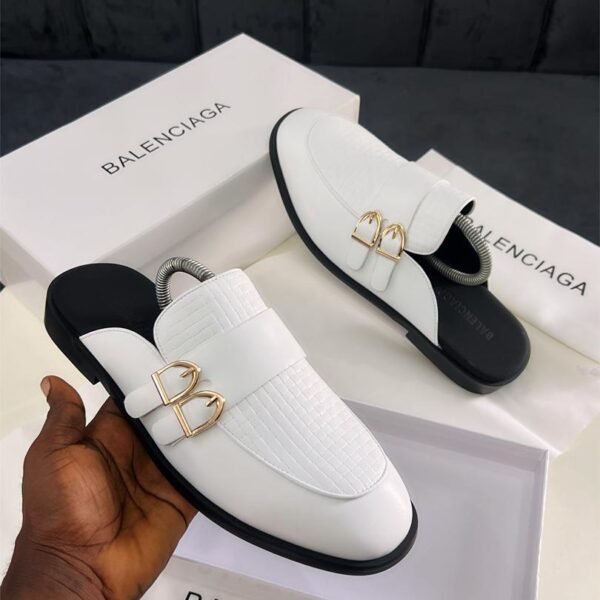 The Balenciaga Men's Mules Half-shoes combine effortless style with luxury craftsmanship. Designed for easy wear, these slip-ons feature a modern, minimalist silhouette in premium materials. Perfect for relaxed or polished outfits, they deliver comfort and high-end sophistication in one versatile design. A statement piece for the fashion-conscious man.