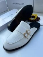 The Balenciaga Men's Mules Half-shoes combine effortless style with luxury craftsmanship. Designed for easy wear, these slip-ons feature a modern, minimalist silhouette in premium materials. Perfect for relaxed or polished outfits, they deliver comfort and high-end sophistication in one versatile design. A statement piece for the fashion-conscious man.